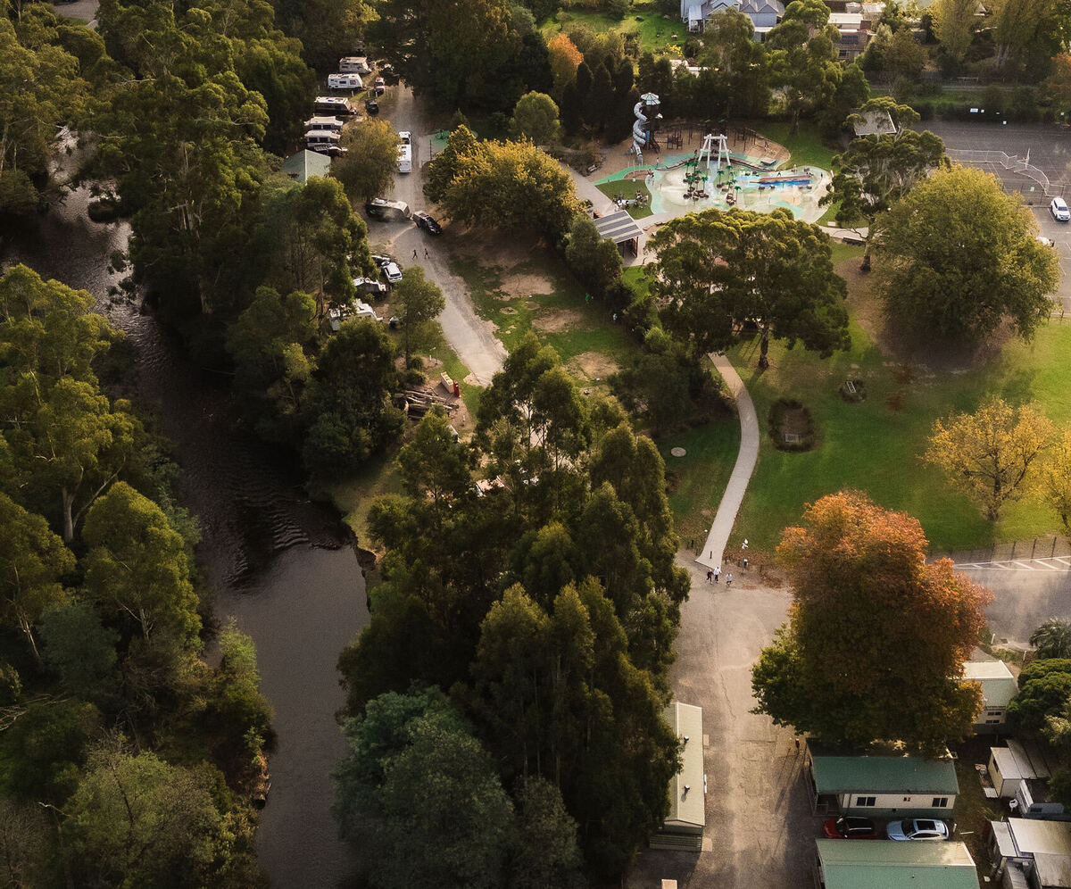 Aerial view of accommodation and camping areas and the Yarra River at Warburton Holiday Park in Warburton, Yarra Valley.