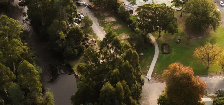 Aerial view of accommodation and camping areas and the Yarra River at Warburton Holiday Park in Warburton, Yarra Valley.
